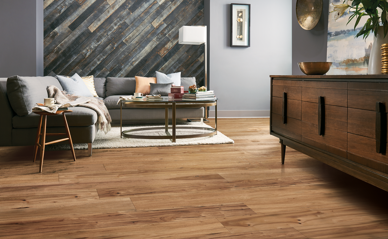 medium toned hardwood flooring in living room