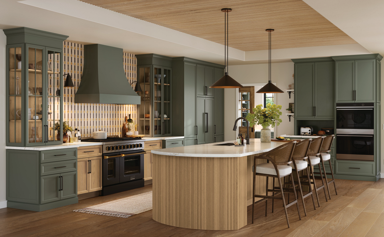 Kitchen with wood-look tile, green cabinetry, and custom tile backsplash