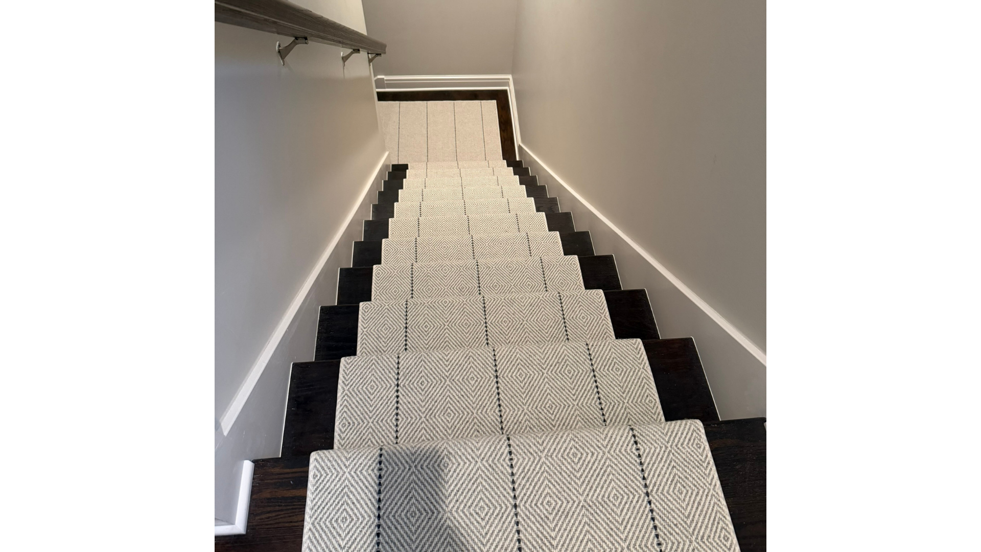 Luxury stair runner on hardwood staircase